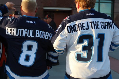 Two Jets fans show off their clever name bars in front the Honda Center in Anaheim before Game 1 between the Winnipeg Jets and Anaheim Ducks. (Jeff Hamilton / Winnipeg Free Press)