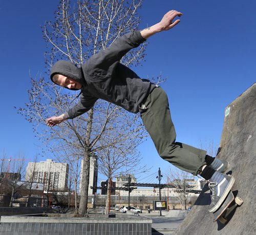 Alex Murray rolls through the Plaza at The Forks on a clear sunny Friday morning.  An afternoon high of 17C is in the weather forecast.  Wayne Glowacki/Winnipeg Free Press April 17  2015