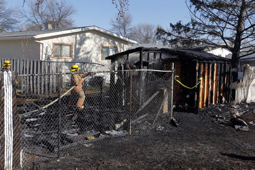 LOCAL - Grass fire that took out a few sheds. $10,000 damage. 55 Marbury Road. Fire investigators on scene. BORIS MINKEVICH/WINNIPEG FREE PRESS APRIL 17, 2015