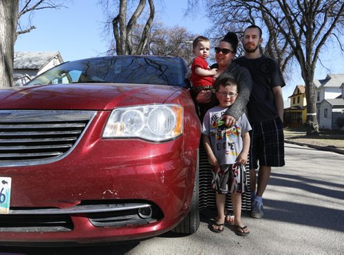 Corey and Leanne Janzen with their boys Parker and Lucas (standing) by their van that had the bumper damaged while parked on Strathcona St. The driver that hit this vehicle and another parked vehicle appeared to be impaired. Gord Sinclair story Wayne Glowacki/Winnipeg Free Press April 17  2015