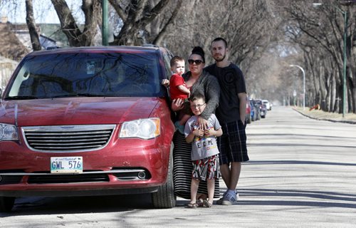 Corey and Leanne Janzen with their boys Parker and Lucas (standing) by their van that had the bumper damaged while parked on Strathcona St. The driver that hit this vehicle and another parked vehicle appeared to be impaired. Gord Sinclair story Wayne Glowacki/Winnipeg Free Press April 17  2015