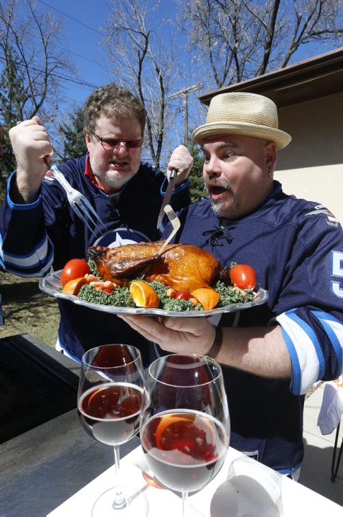 At right, Big Daddy Tazz  and Doug Speirs  "cook up some duck"  for the Winnipeg Jets Stanley Cup series against the Anaheim Ducks.  For Doug Speirs video/column Wayne Glowacki/Winnipeg Free Press April 17  2015