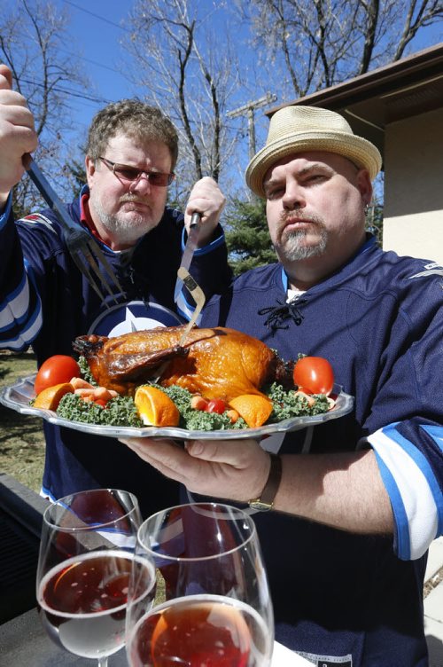 At right, Big Daddy Tazz and Doug Speirs "cook up some duck"  for the Winnipeg Jets Stanley Cup series against the Anaheim Ducks.  For Doug Speirs video/column Wayne Glowacki/Winnipeg Free Press April 17  2015