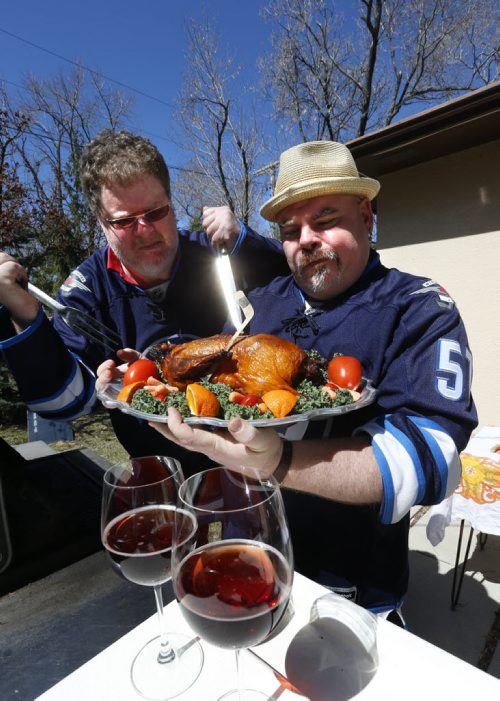 At right, Big Daddy Tazz  and Doug Speirs  "cook up some duck"  for Winnipeg Jets Stanley Cup series against the Anaheim Ducks.  For Doug Speirs video/column Wayne Glowacki/Winnipeg Free Press April 17  2015