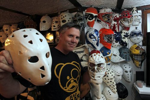Brad Bayer makes goalie masks, not the combo mask-cage ones you see today, but the ones that Jason wore in Friday the 13th.  He thinks while the art work on the sides of masks is nice, it's so intricate that you can't recognize the goalie from the cheap seats like you could in the 70s and early 80s. He has a collection of more than 100 masks. He used to have more than 600 but he  sold a bunch off.. BORIS MINKEVICH/WINNIPEG FREE PRESS APRIL 17, 2015