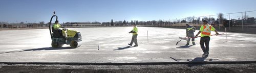 A Chabot Enterprises crew of 9 put the final touches levelling a revamped "Shaughnessy" city soccer field betweeen Pacific and Alexander near Keewatin Friday afternoon.  See story. April 17, 2015 - (Phil Hossack / Winnipeg Free Press)