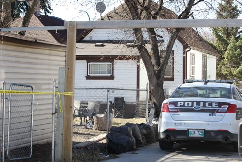 Police tape surrounds the back yard of  719 Flora Ave. Saturday morning just behind 740 Selkirk Ave. where a fight broke out Friday night. Possible homicide occurred at one of these two scenes but not confirmed and no further information to report at this time.    See story.   Ruth Bonneville / Winnipeg Free Press April 16, 2015