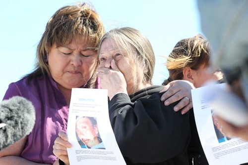 Dorthy Starr, mother to Christopher Guimond, is comforted by family members on Saturday afternoon as she is moved emotionally while talking to media about her missing adult son (Chris Guimond) since April 7th. The family prepares to hand out bulletins' in the Polo Park area where he was last headed. Other family members in photo include, Christopher's cousin Bernice Catcheway (purple), Bobbi Starr (his sister, rear, bangs) and cousin Dorthy Swampy (glasses).    See story.   Ruth Bonneville / Winnipeg Free Press April 18, 2015