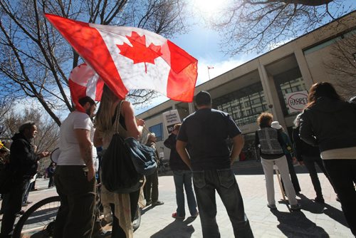 A group of approx 100 people gathered together at City Hall Saturday afternoon to protest Bill C-51.     Ruth Bonneville / Winnipeg Free Press April 18, 2015