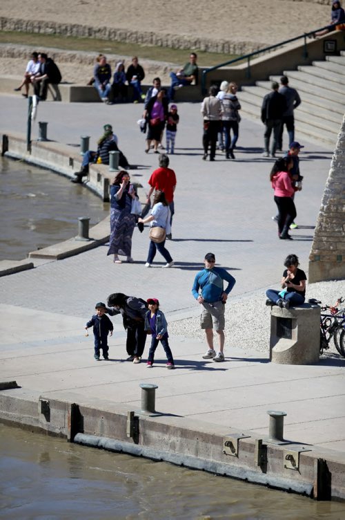 People out on the River Walk along the Assiniboine River at The Forks, Saturday, April 18, 2015. (TREVOR HAGAN/WINNIPEG FREE PRESS)