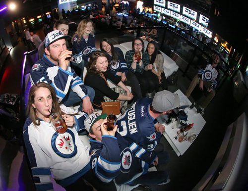 A group of fans watching the Winnipeg Jets second playoff game at Reset Interactive Ultralounge on Pembina Highway, Saturday, April 18, 2015. (TREVOR HAGAN/WINNIPEG FREE PRESS)