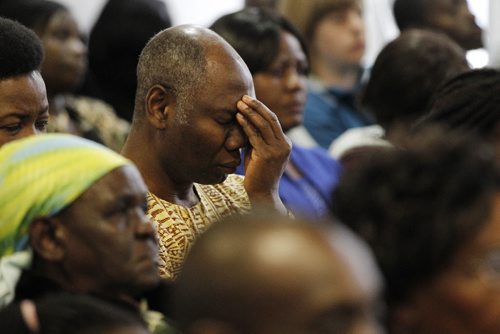 April 19, 2014 - 150419 -  A man reflects during a minute of silence as members of the African-Canadian community came together for a prayer service to remember that two weeks ago, Islamic terrorists shot, killed and injured 147 innocent Kenyans at Garissa University. The prayer service took place Sunday, April 19, 2015 at Immanuel Fellowship Church.  John Woods / Winnipeg Free Press