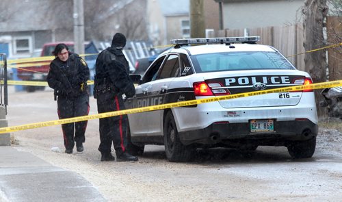 Winnipeg Police have taped off a large area surrounding the Highfield Apartment on Highfield St in Norwood Flats Monday morning-Breaking News- Apr 20, 2015   (JOE BRYKSA / WINNIPEG FREE PRESS)