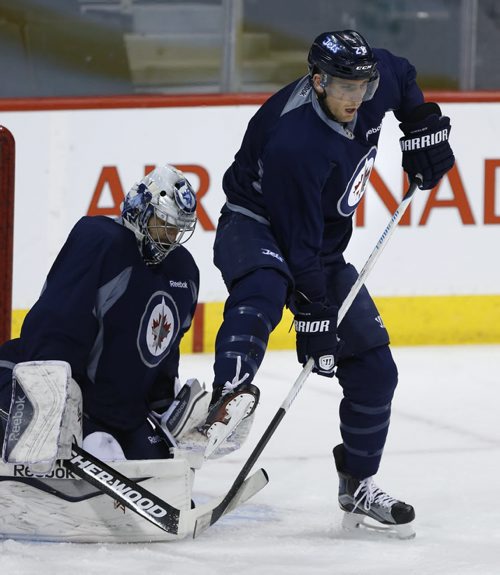 Winnipeg Jets Blake Wheeler deflects shot in front of   Ondrej Pavelec  at the practice in the MTS Centre Monday morning. Winnipeg Jets  face the Anaheim Ducks Monday night in Game 3 of their Western Conference First Round series.Wayne Glowacki/Winnipeg Free Press April 20 2015