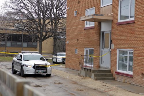 NEWS - A homicide investigation is ongoing after a man died from gunshot wounds early Monday morning on Highfield Street in Norwood Flats. Here is the back lane by the condos. BORIS MINKEVICH/WINNIPEG FREE PRESS APRIL 20, 2015