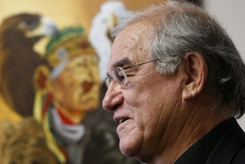 Paul Chartrand, a 71 year old retired law professor whos being called to the bar, to practice law. He is standing by artwork in Norman Boudreau's office. Alex Paul story Wayne Glowacki/Winnipeg Free Press April 20 2015