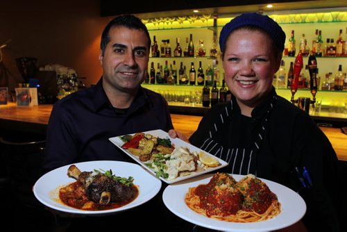 ENT - REST REVIEW - Bellissimo Restaurant & Lounge. L-R Owner Greg Gagliardi and Chef Jessica Cuthbert pose with L-R Lamb shank , Lemon veal scallopini, Spaghetti with veal meatballs. BORIS MINKEVICH/WINNIPEG FREE PRESS APRIL 20, 2015