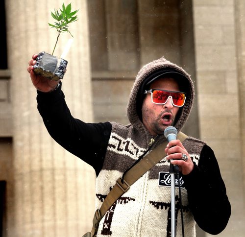 4:20-"Med-Man brandishes a cloned marijuana plant as he espouses the use of medicinal weed at the legislature Monday afternoon as about 700 participants gathered to rally for the legalization of pot. See release. April 20, 2015 - (Phil Hossack / Winnipeg Free Press)