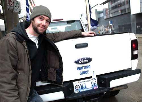Parker Stephenson shows off his new truck decal ahead of Game 3 of the Jets' playoff series Monday. (Jessica Botelho-Urbanski / Winnipeg Free Press)