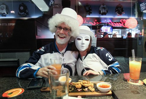 Colin Crackston (left) and Morgan Makwich (right) grab a bite to eat at Moxies prior the to third game of the Stanley Cup playoff series between the Winnipeg Jets and the Anaheim Ducks at MTS Centre in Winnipeg, Manitoba. 150420 - Monday, April 20, 2015 -  (MIKE DEAL / WINNIPEG FREE PRESS)