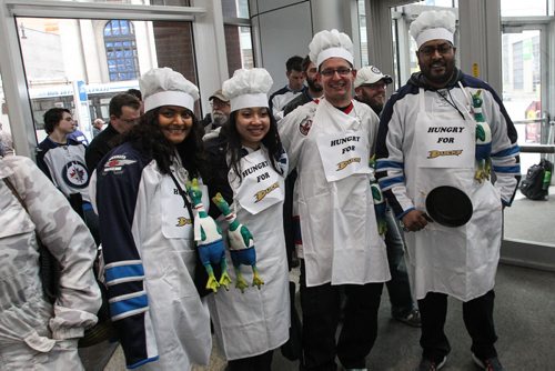 (l-r) Melissa Hosein, Kim Nguyen, Joseph Maksymowicz and Rahim Hosein dressed as chefs arrive prior the to third game of the Stanley Cup playoff series between the Winnipeg Jets and the Anaheim Ducks at MTS Centre in Winnipeg, Manitoba. 150420 - Monday, April 20, 2015 -  (MIKE DEAL / WINNIPEG FREE PRESS)