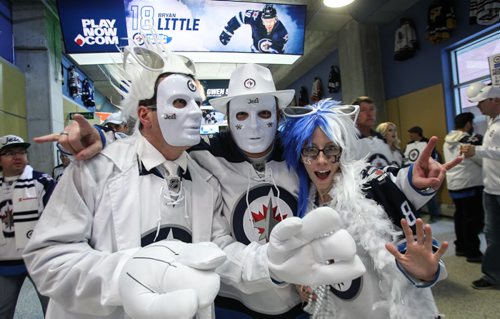 Rene Bisson (left), Blair Thomson (centre), and Janelle Bisson (right) arrive prior the to third game of the Stanley Cup playoff series between the Winnipeg Jets and the Anaheim Ducks at MTS Centre in Winnipeg, Manitoba. 150420 - Monday, April 20, 2015 -  (MIKE DEAL / WINNIPEG FREE PRESS)