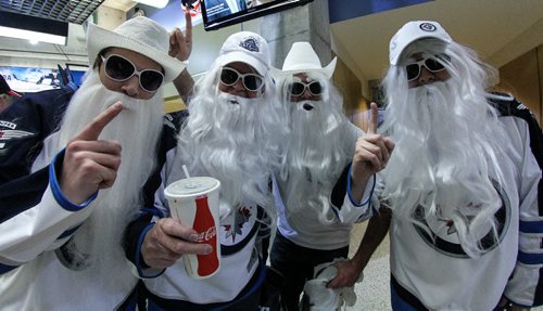 Michael Main (left), Ralph Johnson (second left), David Main (second right) and Steven Garland (right) prior the to third game of the Stanley Cup playoff series between the Winnipeg Jets and the Anaheim Ducks at MTS Centre in Winnipeg, Manitoba. 150420 - Monday, April 20, 2015 -  (MIKE DEAL / WINNIPEG FREE PRESS)