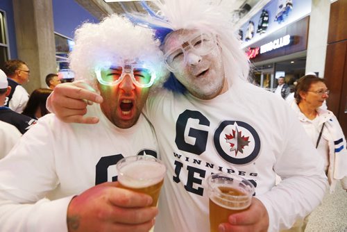 Steve Hnatishin and Ryan Gulakow celebrate prior to NHL game 3 playoff action in Winnipeg on Monday, April 20, 2015. John Woods/Winnipeg Free Press