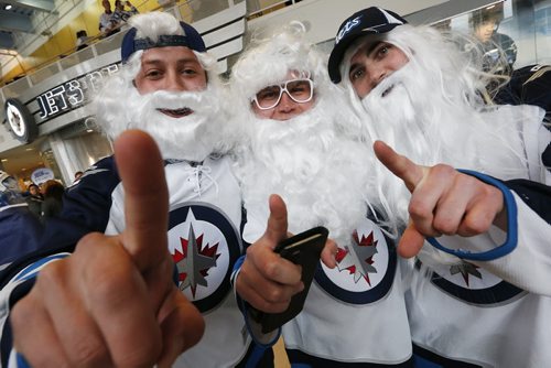 Michael Crabb, Steven Jaques and Kurt Conroy celebrate prior to NHL game 3 playoff action in Winnipeg on Monday, April 20, 2015. John Woods/Winnipeg Free Press