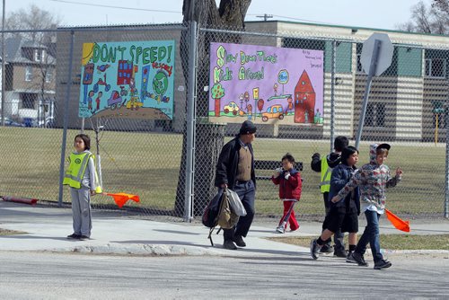 LOCAL -  Critics are saying that there is not enough and poor signage around school zones, causing motorists to speed and the city to profit from tickets. People are asking for better signs, so that drivers can be more aware. Photo taken new Greenway School in Winnipeg. BORIS MINKEVICH/WINNIPEG FREE PRESS APRIL 21, 2015