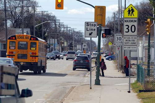 LOCAL -  Critics are saying that there is not enough and poor signage around school zones, causing motorists to speed and the city to profit from tickets. People are asking for better signs, so that drivers can be more aware. Photo taken new Greenway School in Winnipeg. BORIS MINKEVICH/WINNIPEG FREE PRESS APRIL 21, 2015