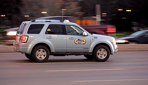 BORIS MINKEVICH / WINNIPEG FREE PRESS 071023 Generic taxi speeding along the road picture. Photo taken on Portage Ave.