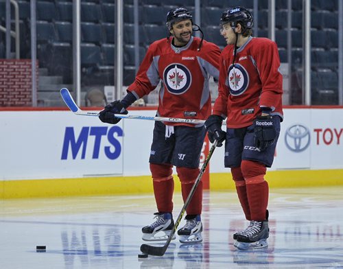 Winnipeg Jets' Dustin Byfuglien (33) and Ben Chiarot (63) during the morning pre-game skate at MTS Centre. The Jets will face-off against the Anaheim Ducks in the fourth game of their Stanley Cup playoff series tonight.   150422 April 22, 2015 Mike Deal / Winnipeg Free Press