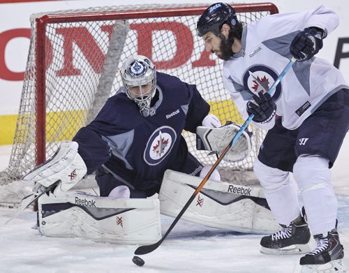 Winnipeg Jets' goaltender Ondrej Pavelec (31) and Chris Thorburn (22) during the morning pre-game skate at MTS Centre. The Jets will face-off against the Anaheim Ducks in the fourth game of their Stanley Cup playoff series tonight.   150422 April 22, 2015 Mike Deal / Winnipeg Free Press