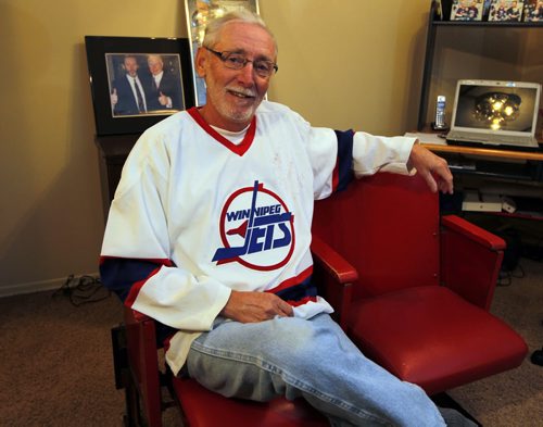 Rod Palson, the man behind the White Out with the old Jets is like a proud father these days. Rod Palson took his son on Monday and he's taking his daughter tonight. In the photo he's wearing his jersey from the old days. Here he poses in his old arena jets seats that someone gave to him as a gift. BORIS MINKEVICH/WINNIPEG FREE PRESS APRIL 22, 2015