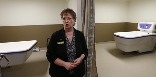 On the media tour Wednesday,  Mary Knight, CEO for Golden Links Lodge shows off two of the four new resident bath tubs and renovations to tub rooms on the main level at the Lodge that were upgraded while residents were evacuated. (These improvements were not caused by the flood damage. While residents were evacuated it was easier to do the upgrades on the main level )Kevin RollasonWayne Glowacki/Winnipeg Free Press April 22 2015