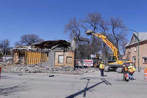 545 Sargent Avenue gets demolished this afternoon. BORIS MINKEVICH/WINNIPEG FREE PRESS APRIL 22, 2015