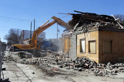 545 Sargent Avenue gets demolished this afternoon. BORIS MINKEVICH/WINNIPEG FREE PRESS APRIL 22, 2015