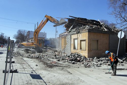 545 Sargent Avenue gets demolished this afternoon. BORIS MINKEVICH/WINNIPEG FREE PRESS APRIL 22, 2015