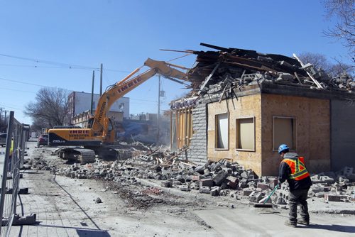 545 Sargent Avenue gets demolished this afternoon. BORIS MINKEVICH/WINNIPEG FREE PRESS APRIL 22, 2015