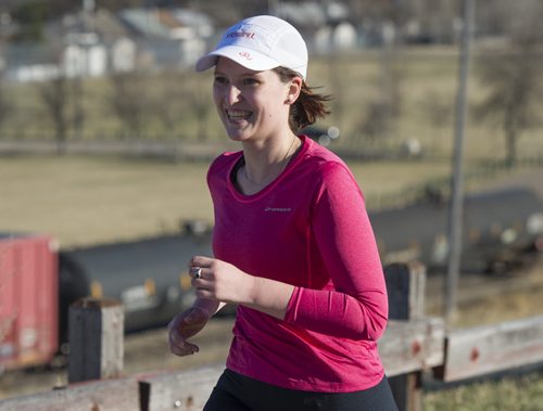 150422 Winnipeg - DAVID LIPNOWSKI / WINNIPEG FREE PRESS  Grace Romund works for the Running Room, and leads a group of runners training for the full and half marathons up the hill at Westview Park (garbage hill) Wednesday April 22, 2015.   Scott Billeck article for 49.8 - TRAINING BASKET