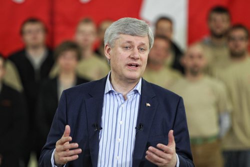 Prime Minister Stephen Harper announces a reduction in small business taxes that was part of the budget which was released Tuesday while at FC Woodworks in Winnipeg Thursday afternoon.  150423 April 23, 2015 Mike Deal / Winnipeg Free Press
