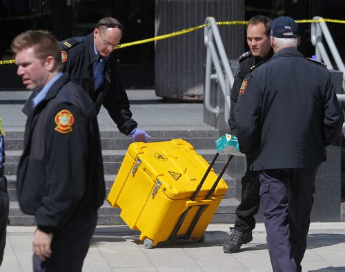 Haz Mat scene at 363 Broadway. The suspicious package was brought out in this yellow case. BORIS MINKEVICH/WINNIPEG FREE PRESS APRIL 23, 2015