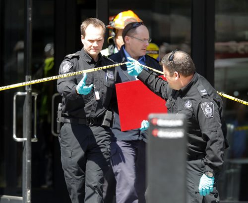 Haz Mat scene at 363 Broadway. The red case here is an X-ray the police took of the package. BORIS MINKEVICH/WINNIPEG FREE PRESS APRIL 23, 2015