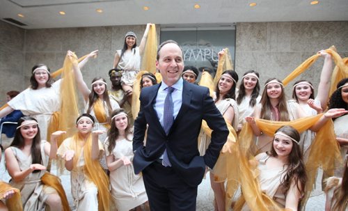 Director and CEO of the Winnipeg Art Gallery Dr. Stephen Borys is all smiles as he is surrounded by en/trance dancers dressed in Greek influenced costumes at the opening of the Olympus exhibit for a private viewing Thursday evening.    Ruth Bonneville / Winnipeg Free Press April 23, 2015