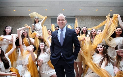 Director and CEO of the Winnipeg Art Gallery Dr. Stephen Borys is all smiles as he is surrounded by en/trance dancers dressed in Greek influenced costumes at the opening of the Olympus exhibit for a private viewing Thursday evening.    Ruth Bonneville / Winnipeg Free Press April 23, 2015