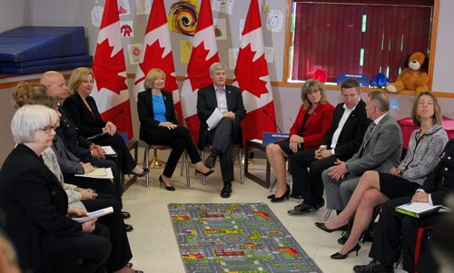 PROTECTING CANADIANS - Canadian Prime Minister Stephen Harper addresses the media at Winakwa Community Centre Friday morning. He was speaking to a community round table. His wife Laureen Harper also in photo sitting next to him. BORIS MINKEVICH/WINNIPEG FREE PRESS APRIL 24, 2015