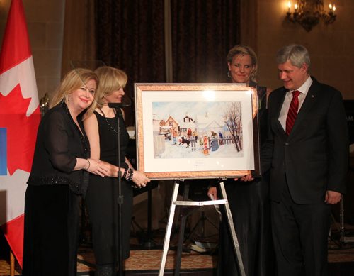 Lianna McDonald, executive director of the Canadian Centre for Child Protection (far left) and her assistant (next to PM) honour Prime Minister Stephen Harper and his wife Mrs. Laureen Harper (second from left)  with a painting by a local artist at  the 30th anniversary celebration of the Canadian Centre for Child Protection Friday evening at The Fort Garry Hotel.   Ruth Bonneville / Winnipeg Free Press April 24, 2015