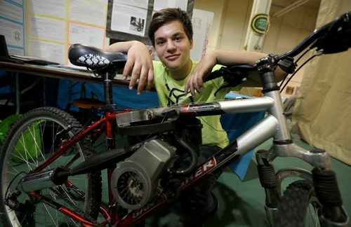 Ariel Lezen and his motorized bicycle at the Manitoba Schools Science Symposium, inside Max Bell Centre at the University of Manitoba, Saturday, April 25, 2015. (TREVOR HAGAN/WINNIPEG FREE PRESS)