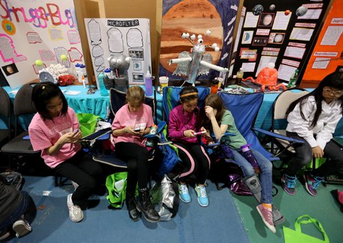 Students try to keep occupied at the Manitoba Schools Science Symposium, inside Max Bell Centre at the University of Manitoba, Saturday, April 25, 2015. (TREVOR HAGAN/WINNIPEG FREE PRESS)